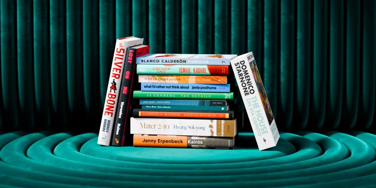 The International Booker Prize longlist books photographed stacked.