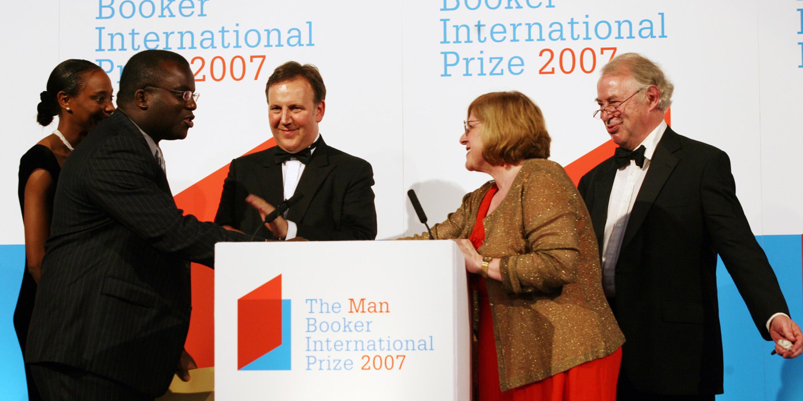 Chidi Achebe and wife collecting the award on behalf of his father Chinua Achebe