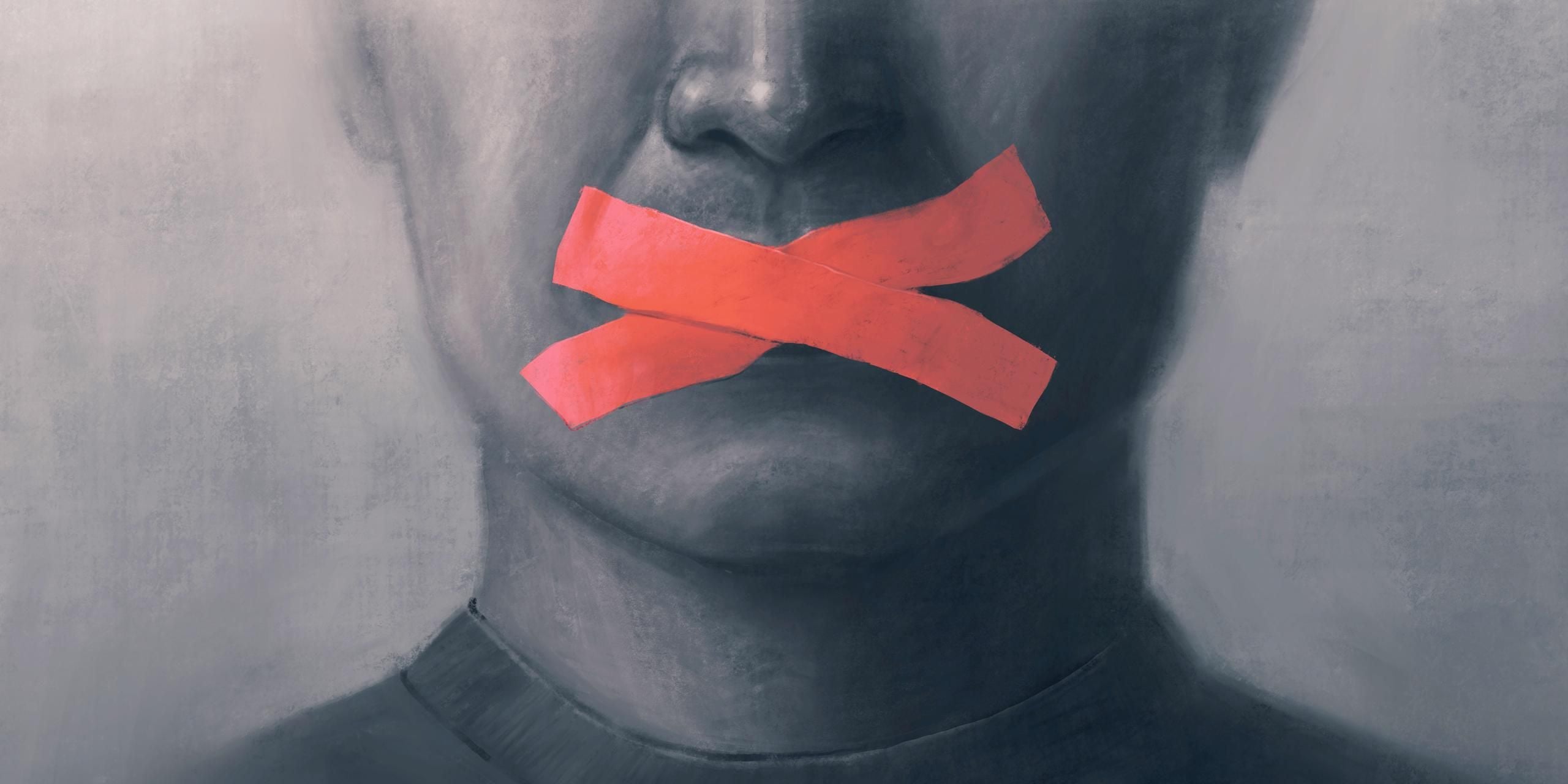 man with tape over his mouth