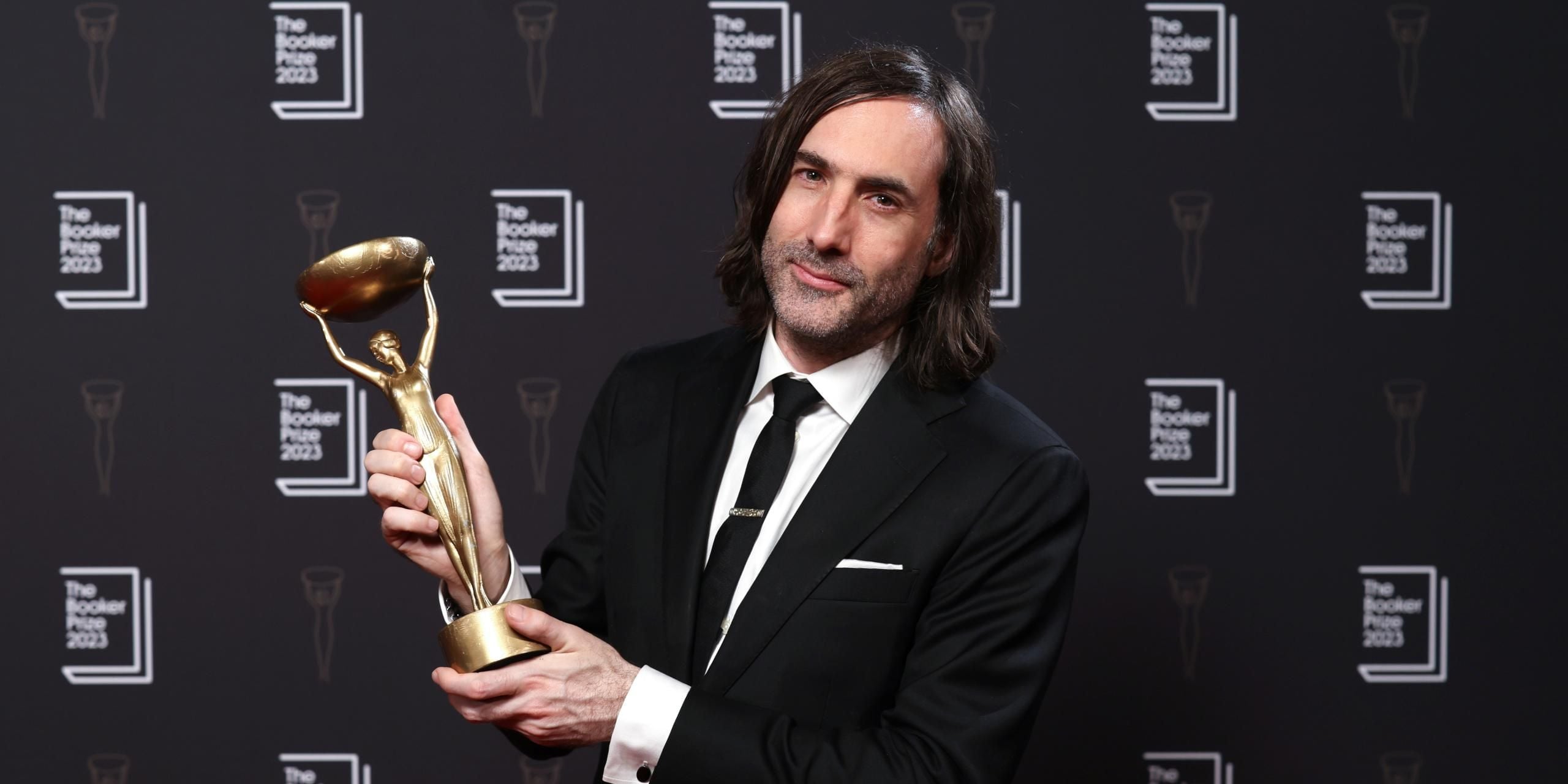 Booker Prize 2023 winner Paul Lynch with the Booker trophy, Iris