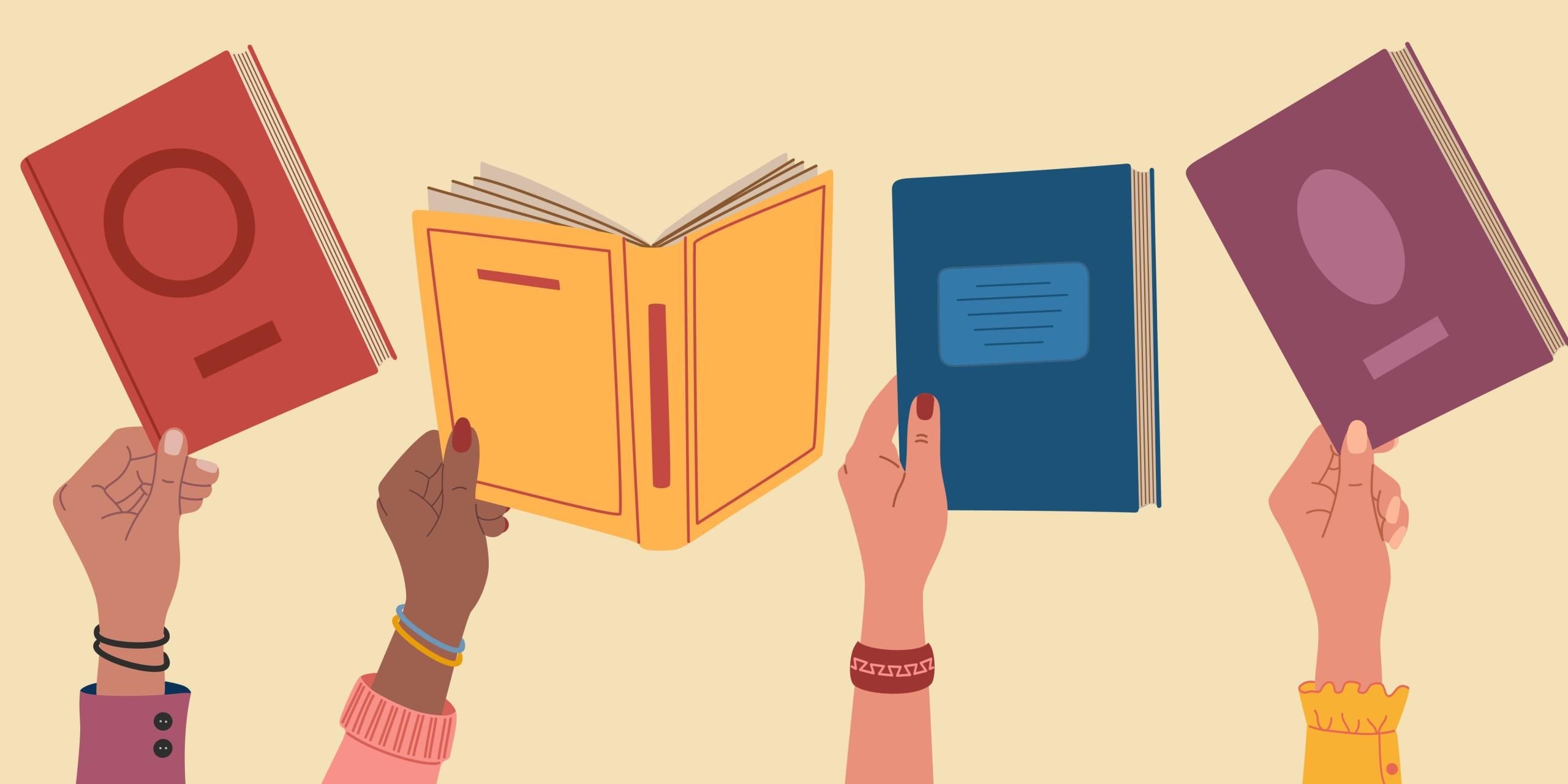 Hand holding up books.