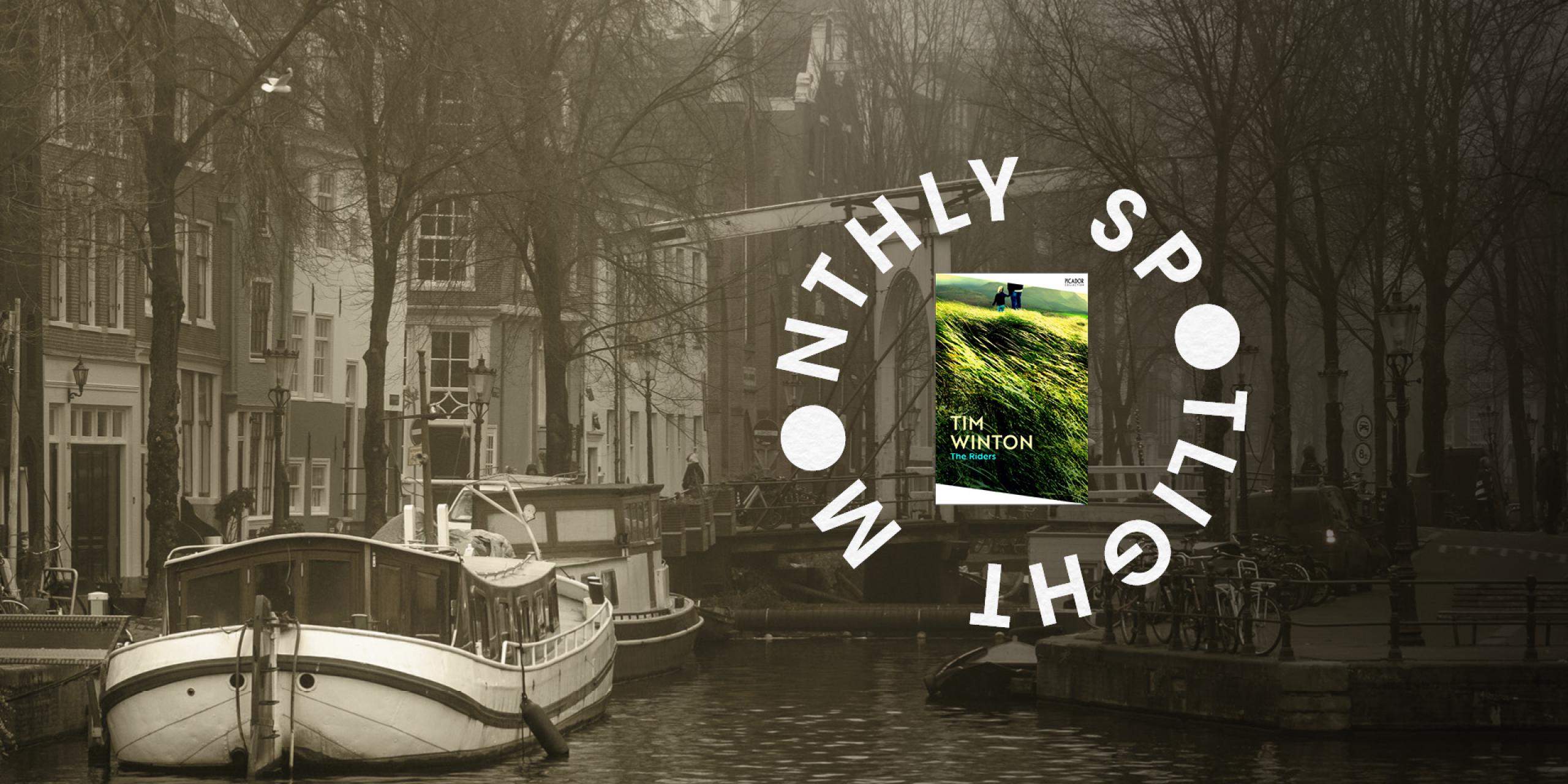 A boat on a canal with the The Riders inside the text Monthly Spotlight in a circle