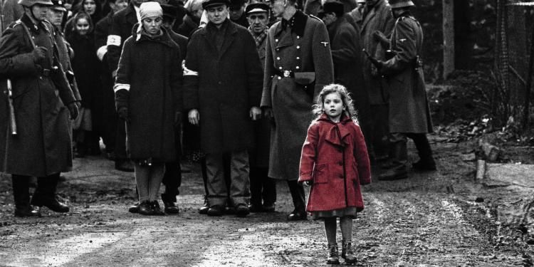 A still from Schindler's List showing a girl in a red coat