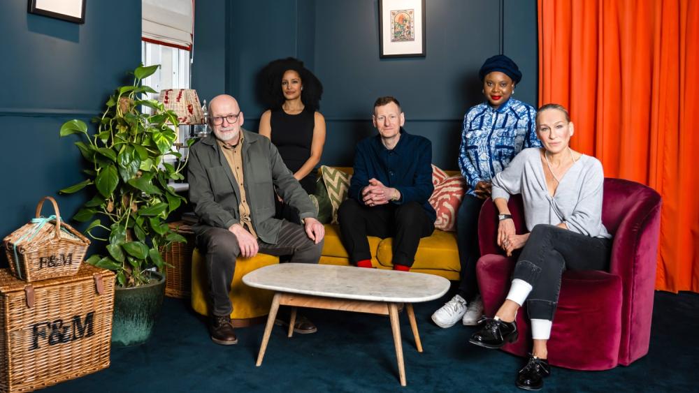 The Booker Prize 2025 judges - Ayọ̀bámi Adébáyọ̀, Chris Power, Roddy Doyle, Sarah Jessica Parker and Kiley Reid - sitting together on a yellow velvet sofa and burgundy velvet armchair
